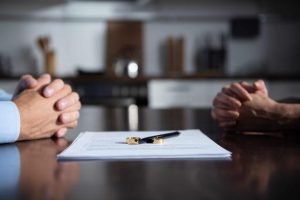Divorcing Couple at Mediation Table Divorcing Couple at Mediation Table